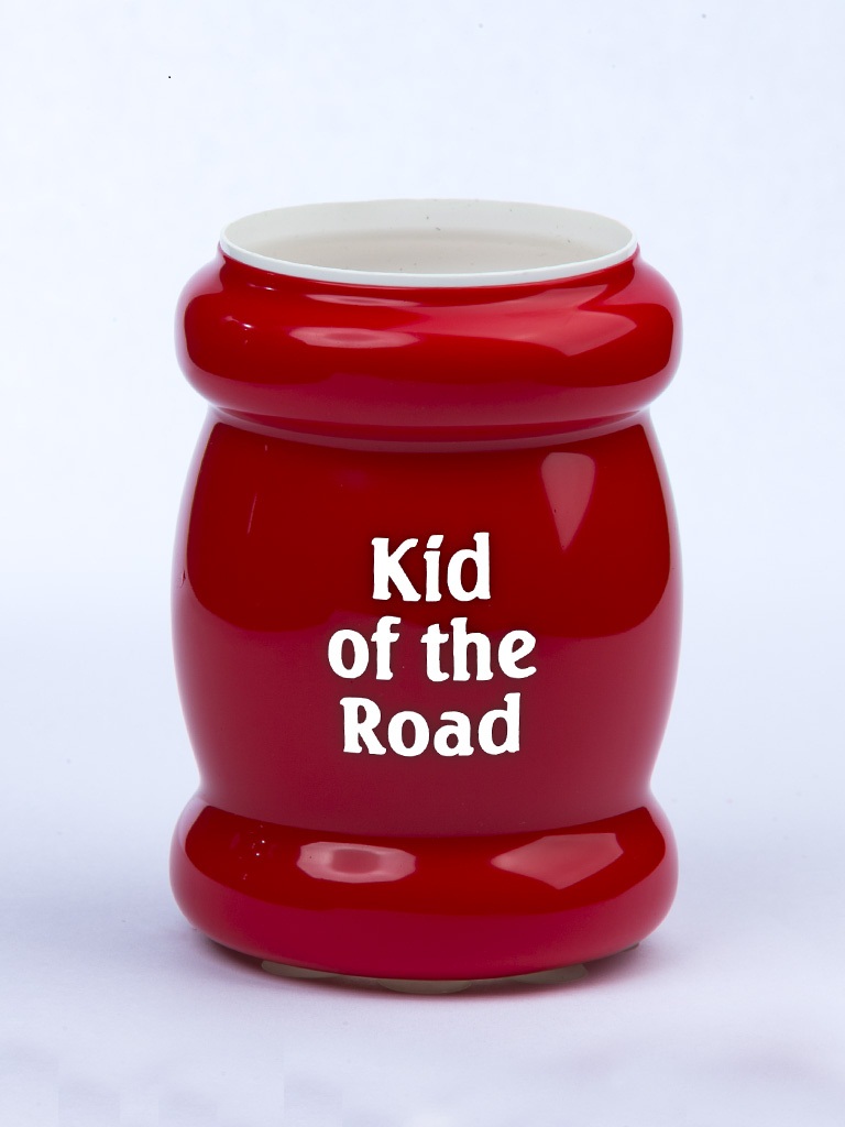 suction koozie kid of the road with white text